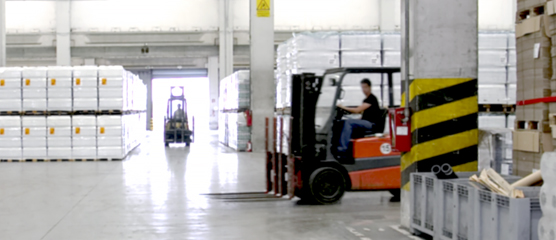 Forklifts operating in a 77G warehouse.